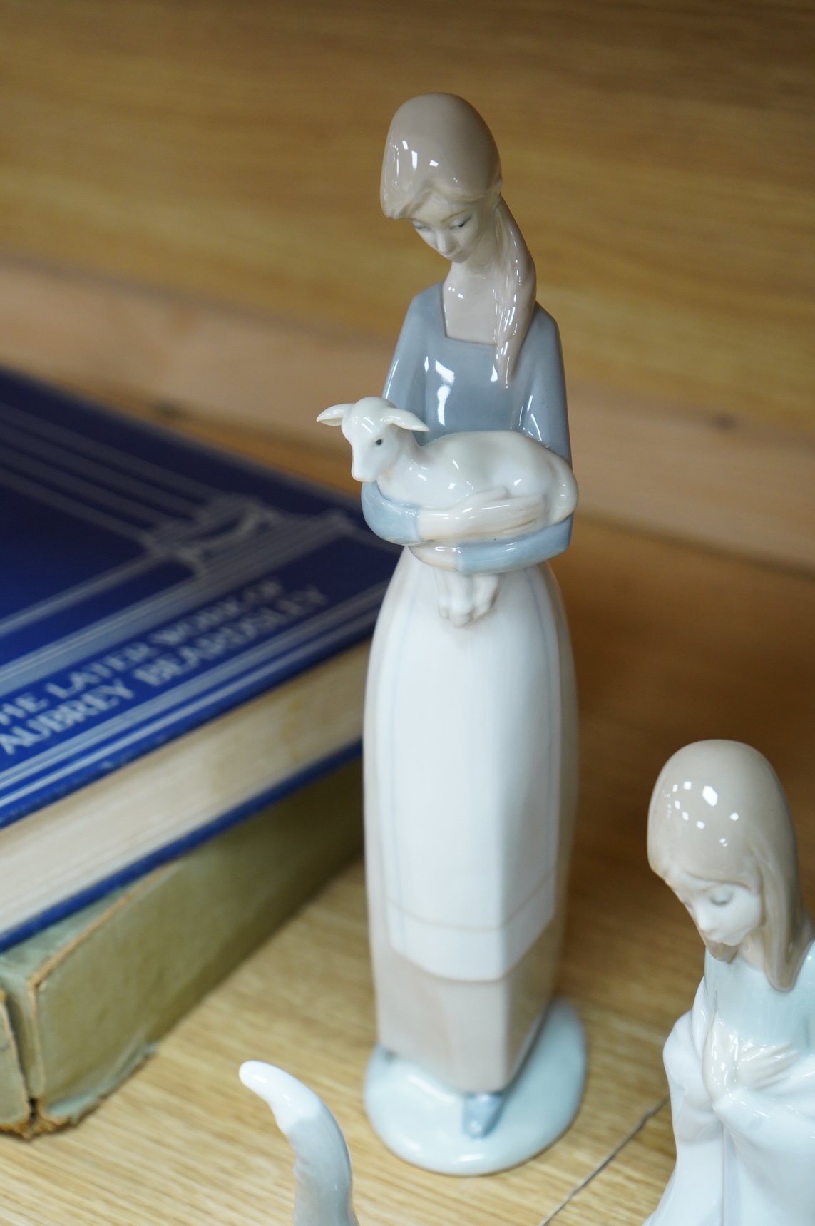 Two Doulton vases, a Casa Pupo pierrot dish and a collection of nine Lladro figures, largest 27cm high